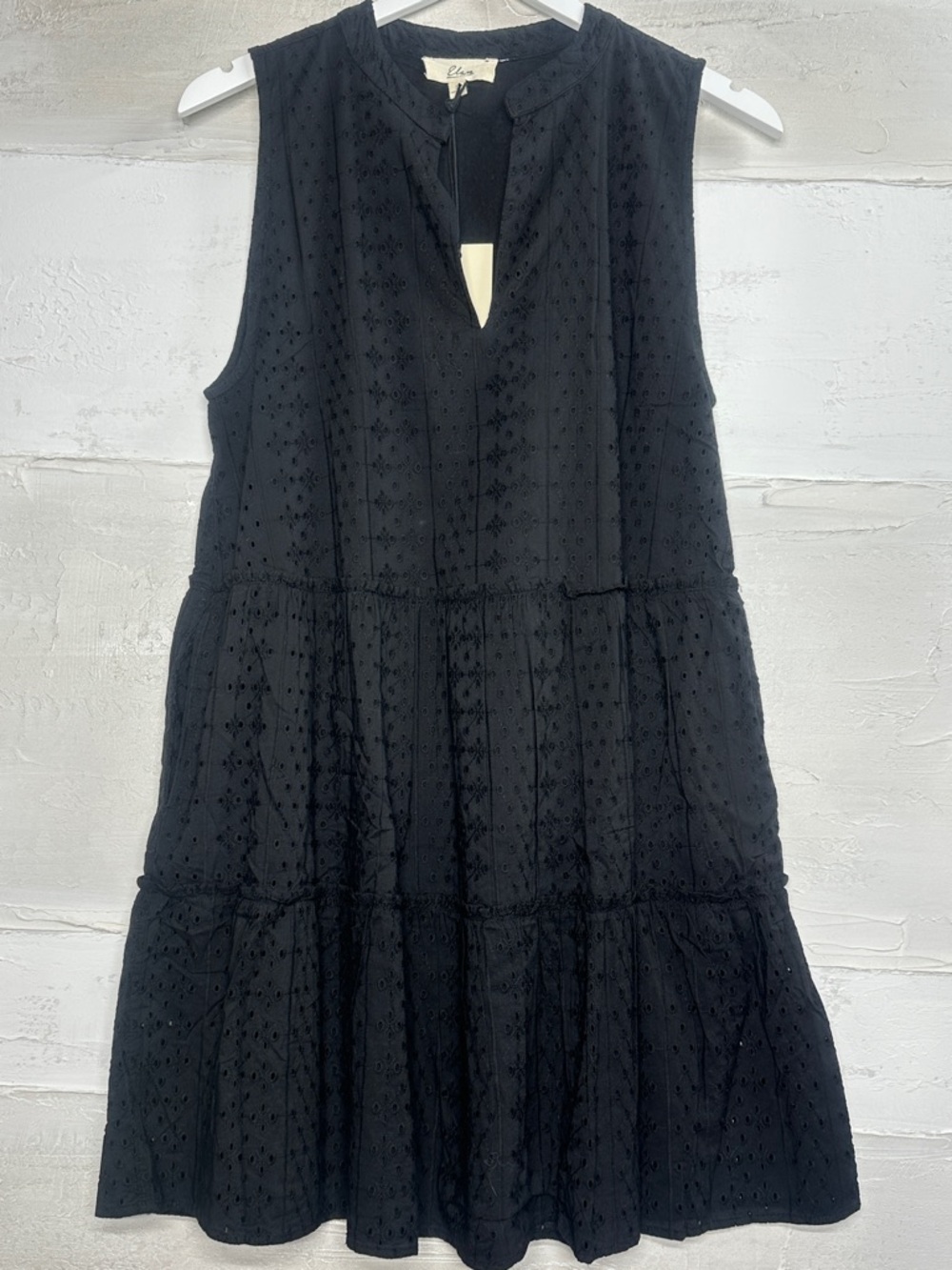 New with tags. Black eyelet dress Elan. Lined w pockets